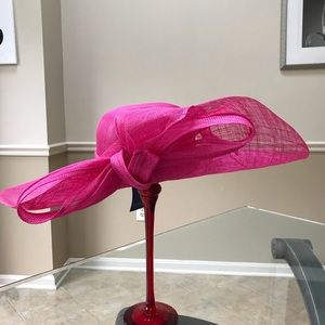 Large sinamay  floppy brim with large bow.